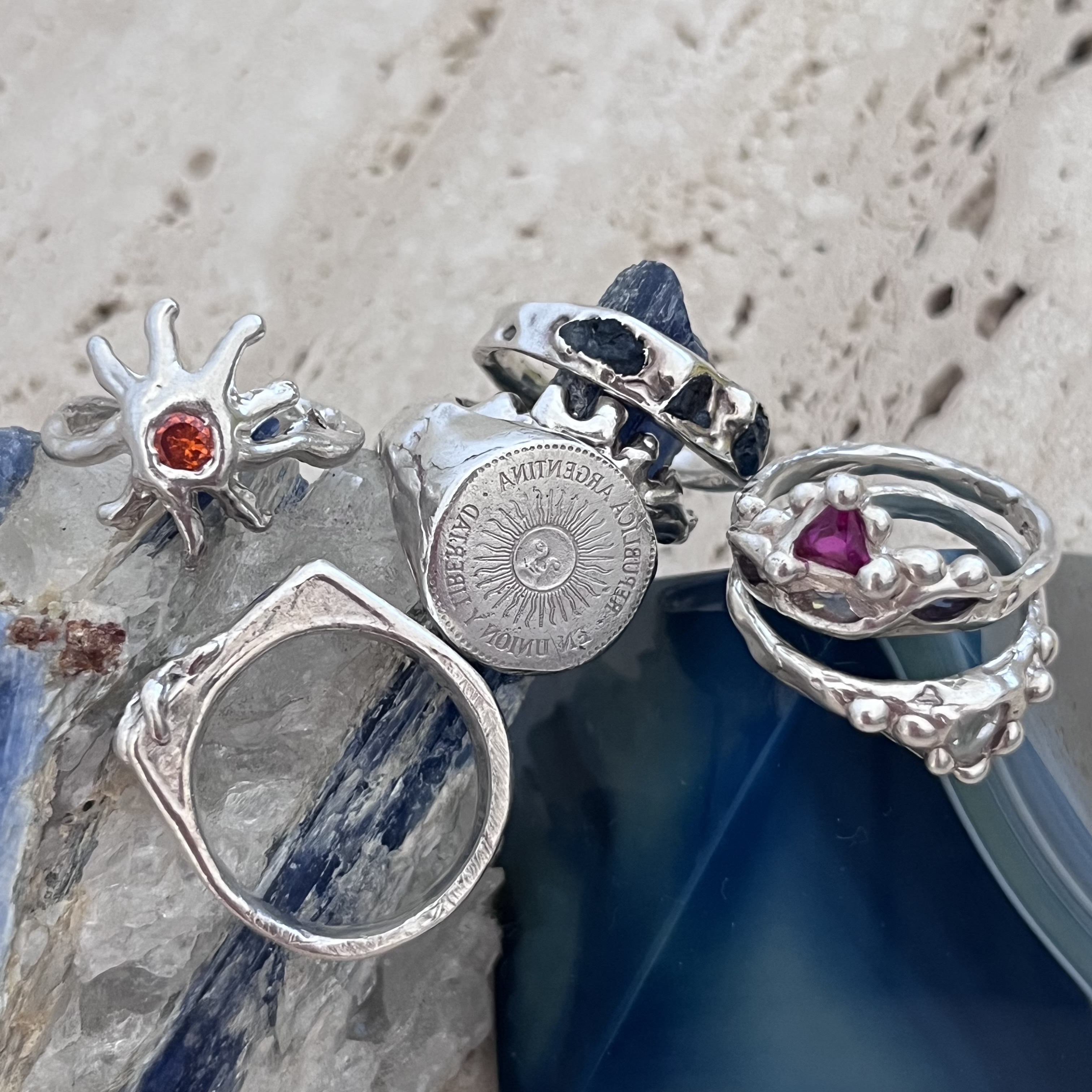 hand with many silver rings