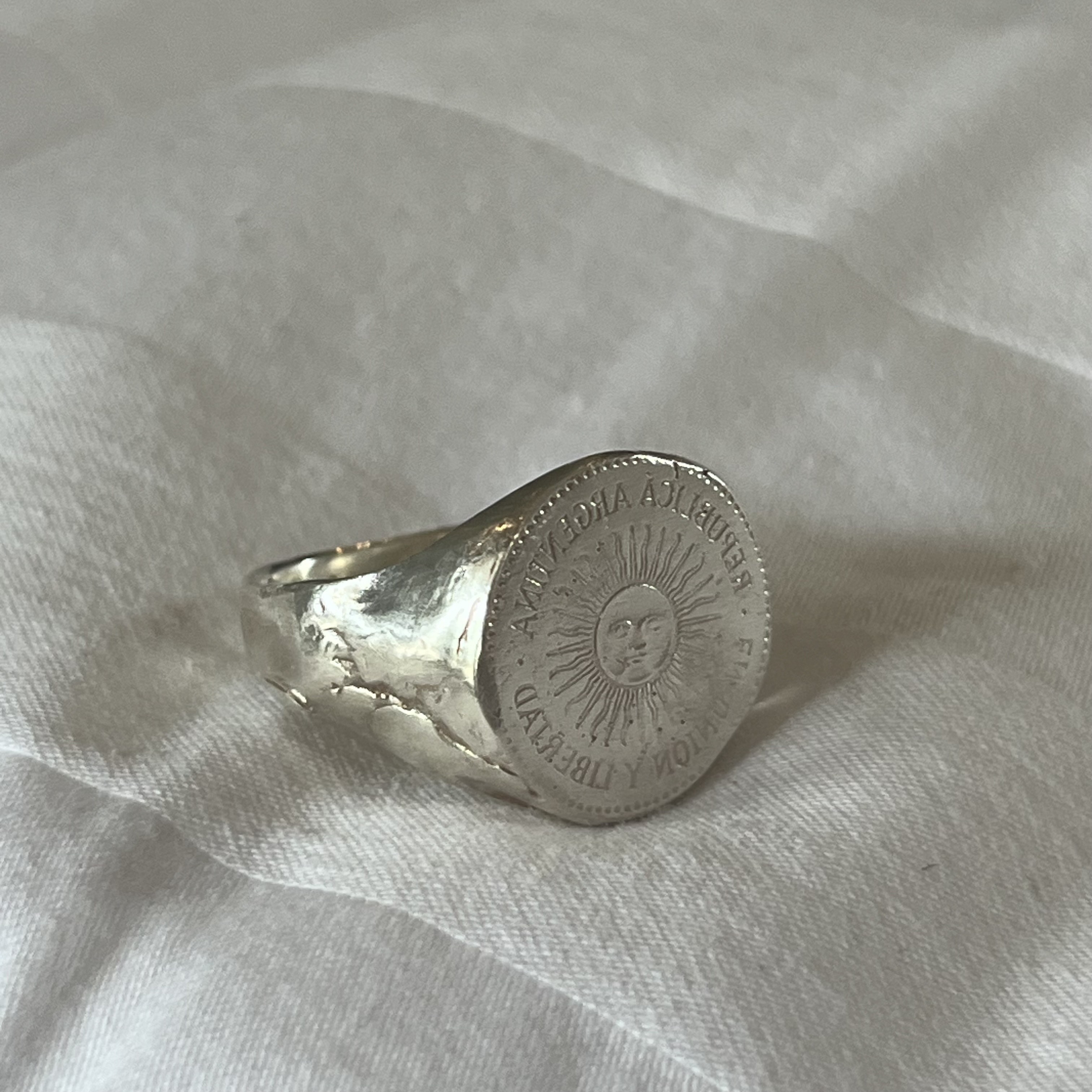 silver ring with sun stamp